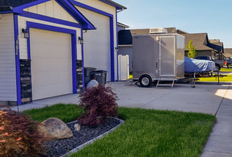 Portable Restroom Rentals in front of a house.